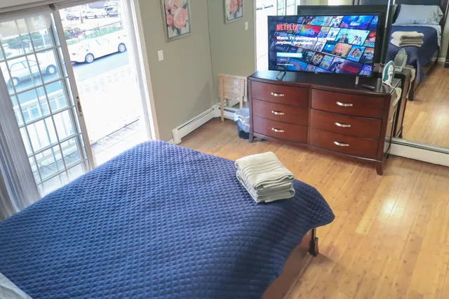 a bedroom with a bed and a dresser