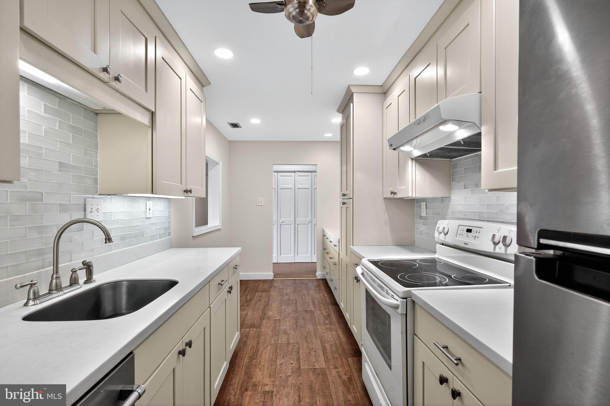 17 Haddonfield Cmns Haddonfield, NJ 08033 - Photo 11 of 37 a kitchen with a sink stove and cabinets