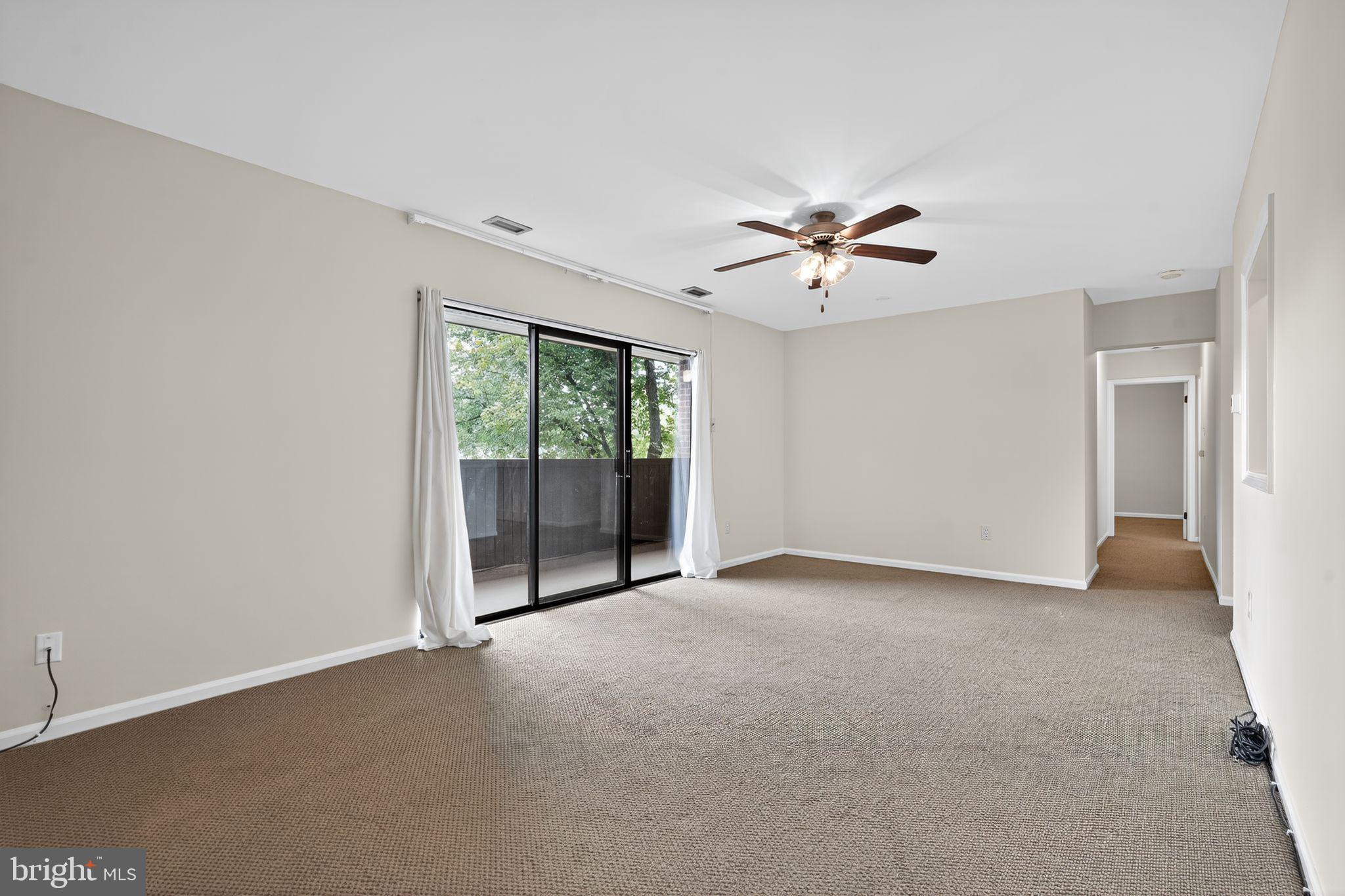 17 Haddonfield Cmns Haddonfield, NJ 08033 - Photo 20 of 37 a view of a room with a ceiling fan and a window