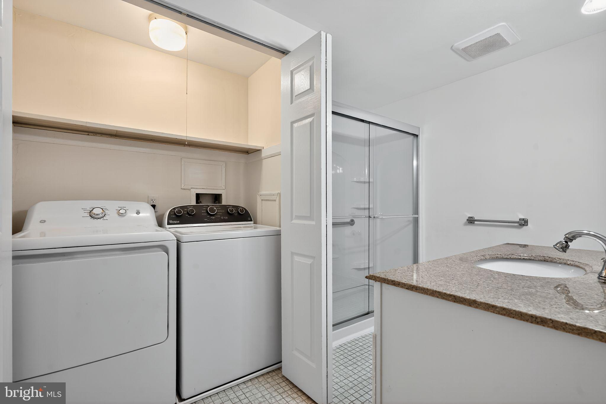 17 Haddonfield Cmns Haddonfield, NJ 08033 - Photo 25 of 37 a bathroom with a sink and a washer dryer