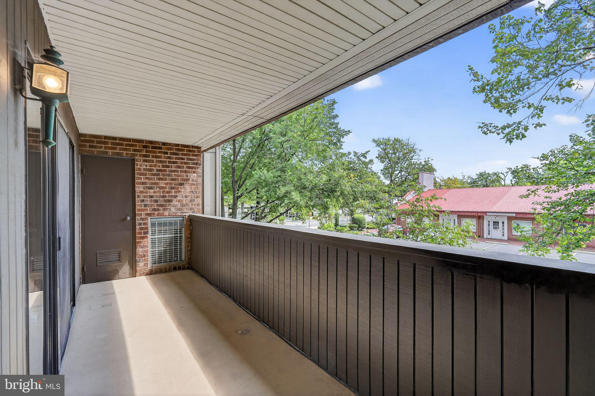 17 Haddonfield Cmns Haddonfield, NJ 08033 - Photo 28 of 37 a view of balcony with wooden floor and fence