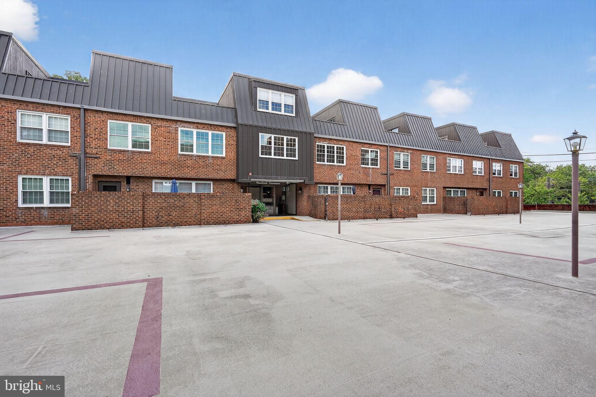 17 Haddonfield Cmns Haddonfield, NJ 08033 - Photo 34 of 37 a front view of a building with a yard