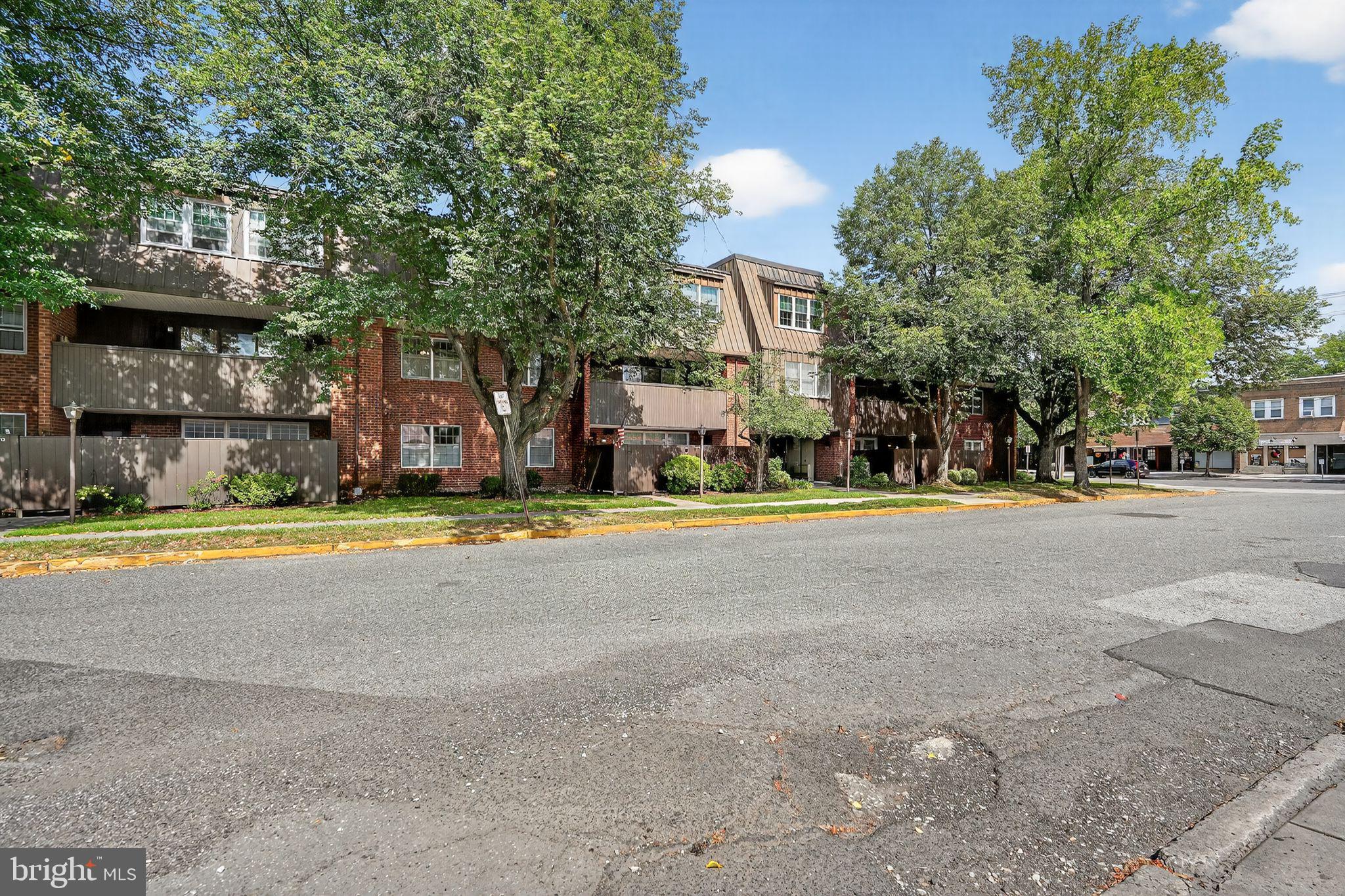 17 Haddonfield Cmns Haddonfield, NJ 08033 - Photo 36 of 37 a view of swimming pool is middle in the middle of a park