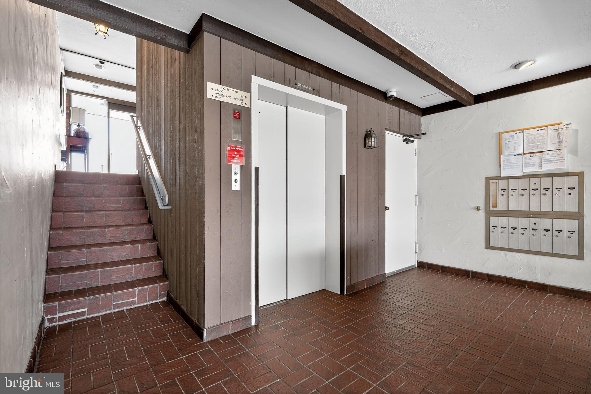 17 Haddonfield Cmns Haddonfield, NJ 08033 - Photo 4 of 37 a view of a hallway with entryway wooden floor and windows