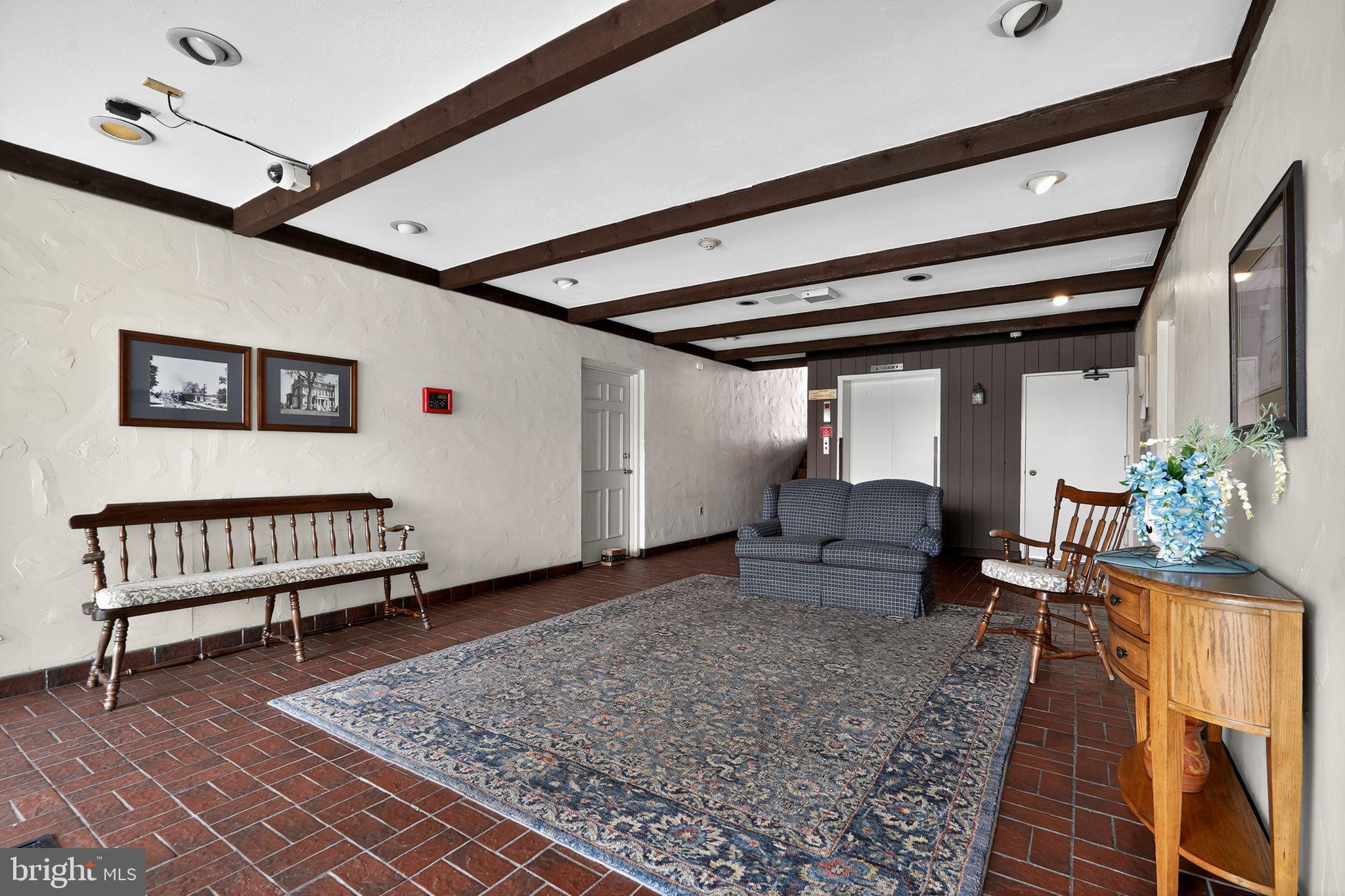 17 Haddonfield Cmns Haddonfield, NJ 08033 - Photo 5 of 37 a living room with furniture and a rug