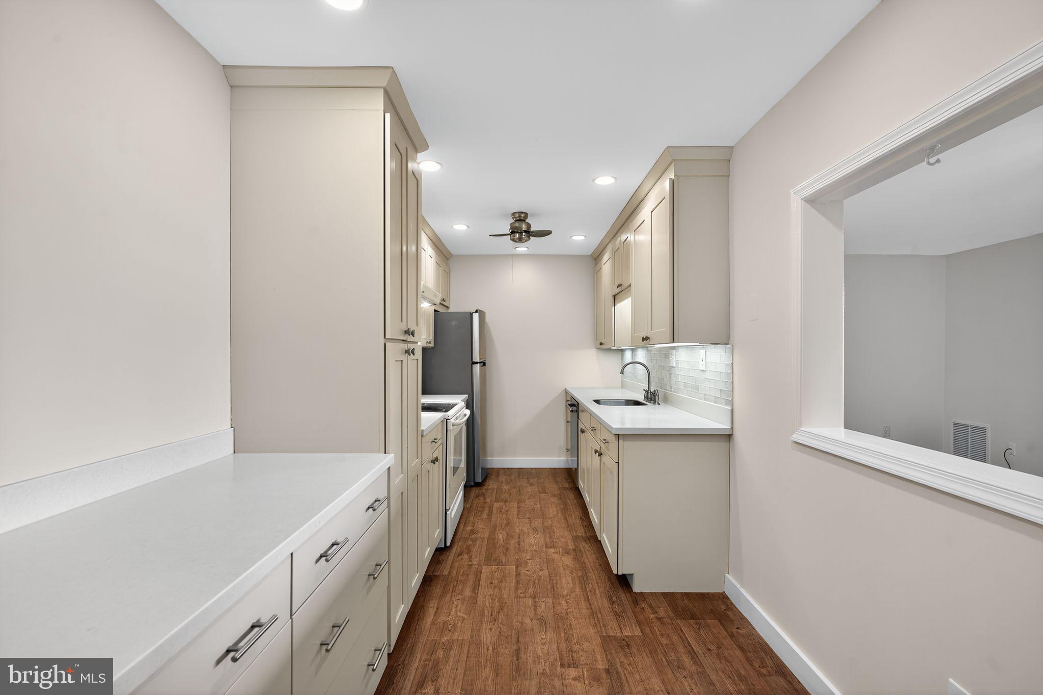 17 Haddonfield Cmns Haddonfield, NJ 08033 - Photo 9 of 37 a bathroom with a sink and mirror