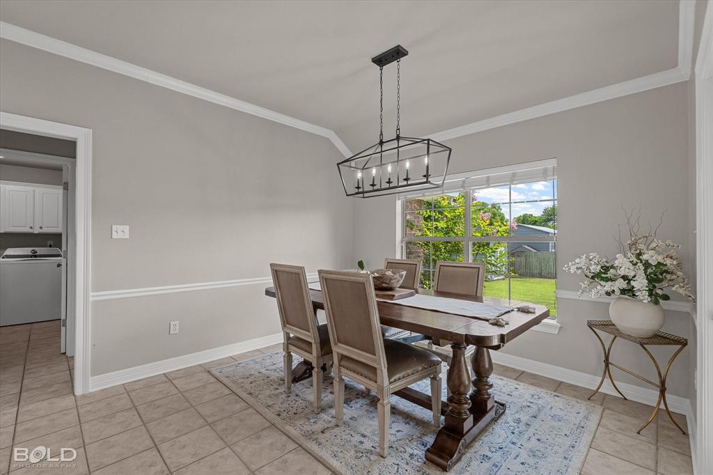 116 Augusta Avenue Benton, LA 71006 - Photo 12 of 38 a view of a dining room with furniture window and chandelier