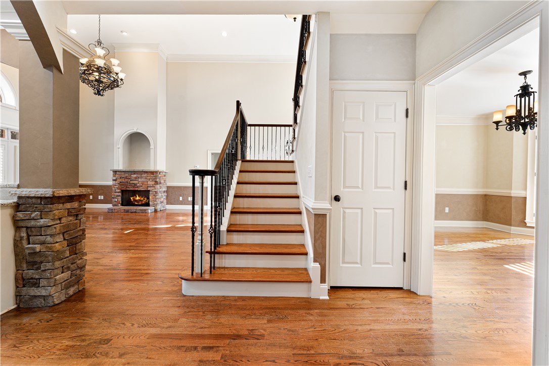 109 Limelight Drive Anderson, SC 29621 - Photo 19 of 34 This inviting interior features a grand staircase and a captivating fireplace, perfect for elegant gatherings.