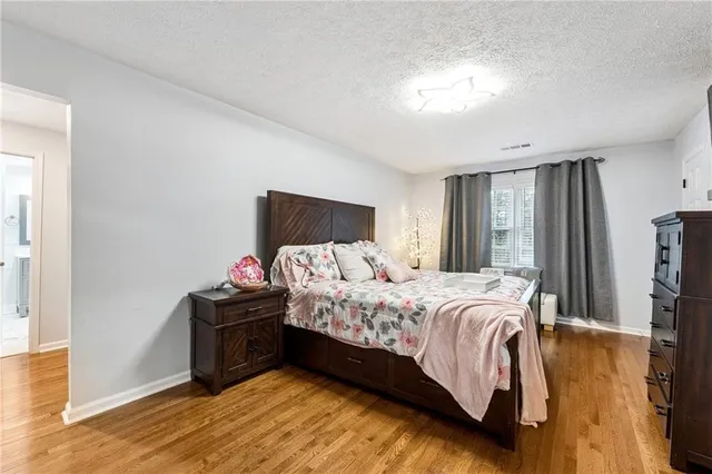 a bedroom with a bed and a tv