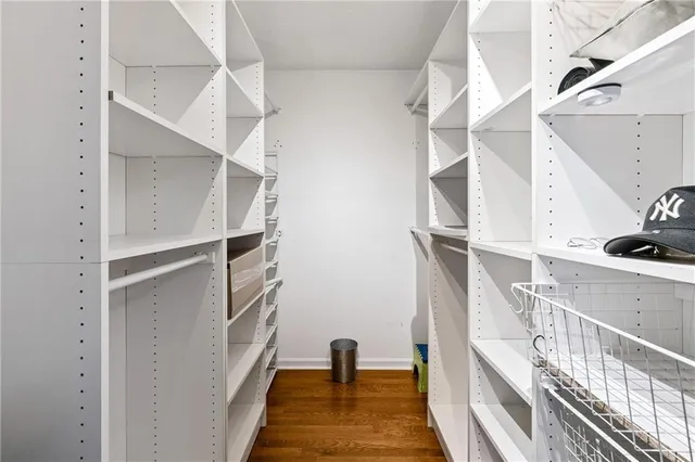 a view of staircase with white walls and a window