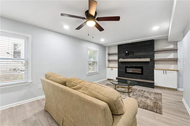 a bedroom with a bed and a ceiling fan