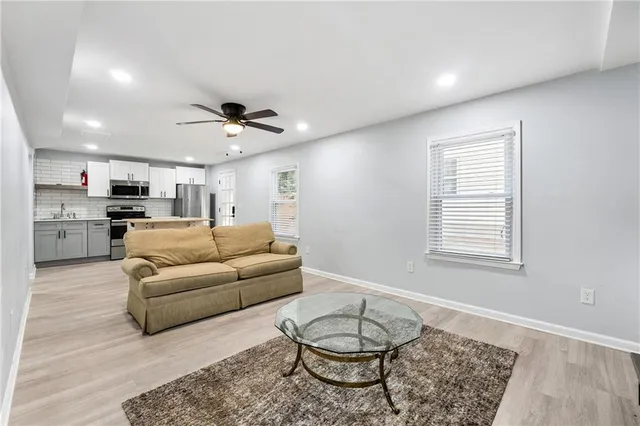 a living room with furniture and a table