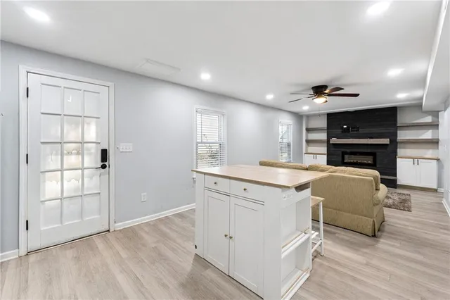 a kitchen with a refrigerator and a sink