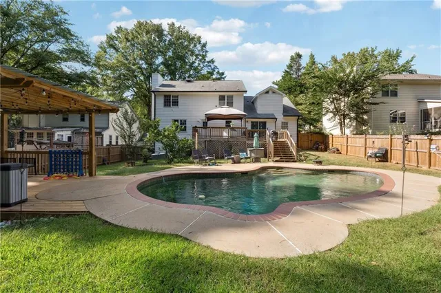 a view of a house with a swimming pool