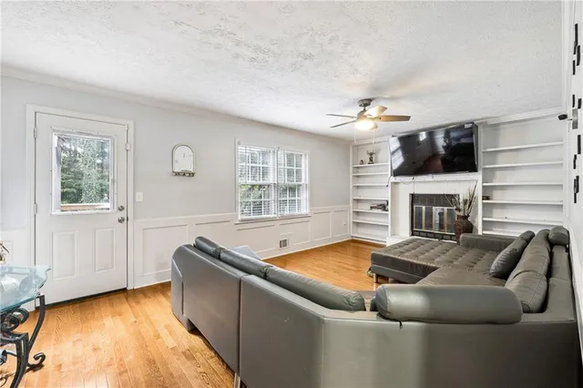 a living room with furniture and a fireplace