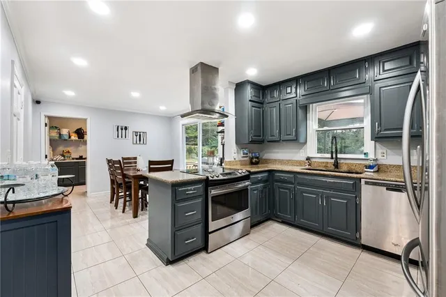 a kitchen with lots of counter top space and appliances