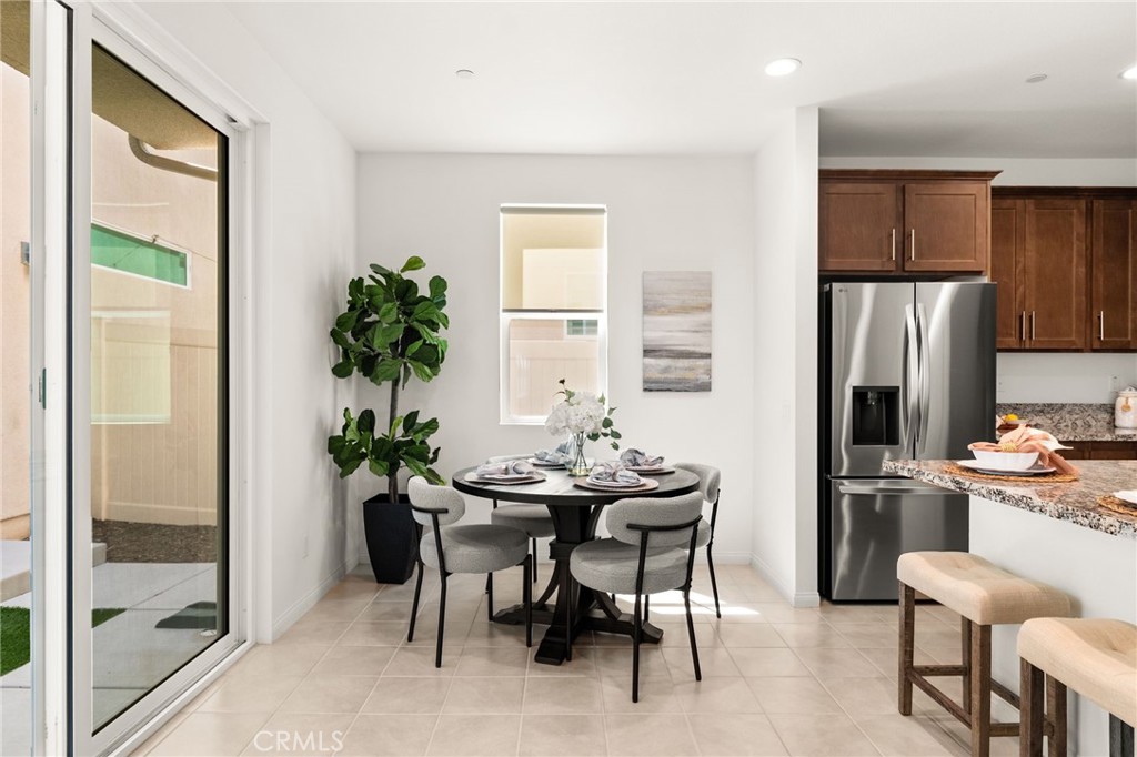 32461 Brunello Way Temecula, CA 92591 - Photo 11 of 46 a view of a dining room with furniture window and outside view