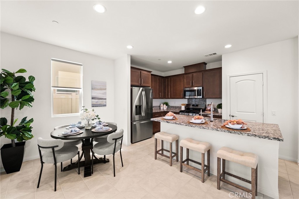 32461 Brunello Way Temecula, CA 92591 - Photo 12 of 46 a view of a dining room with furniture