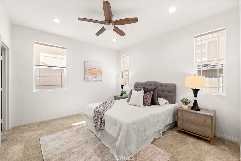 32461 Brunello Way Temecula, CA 92591 - Photo 18 of 46 a bedroom with a large bed and a window