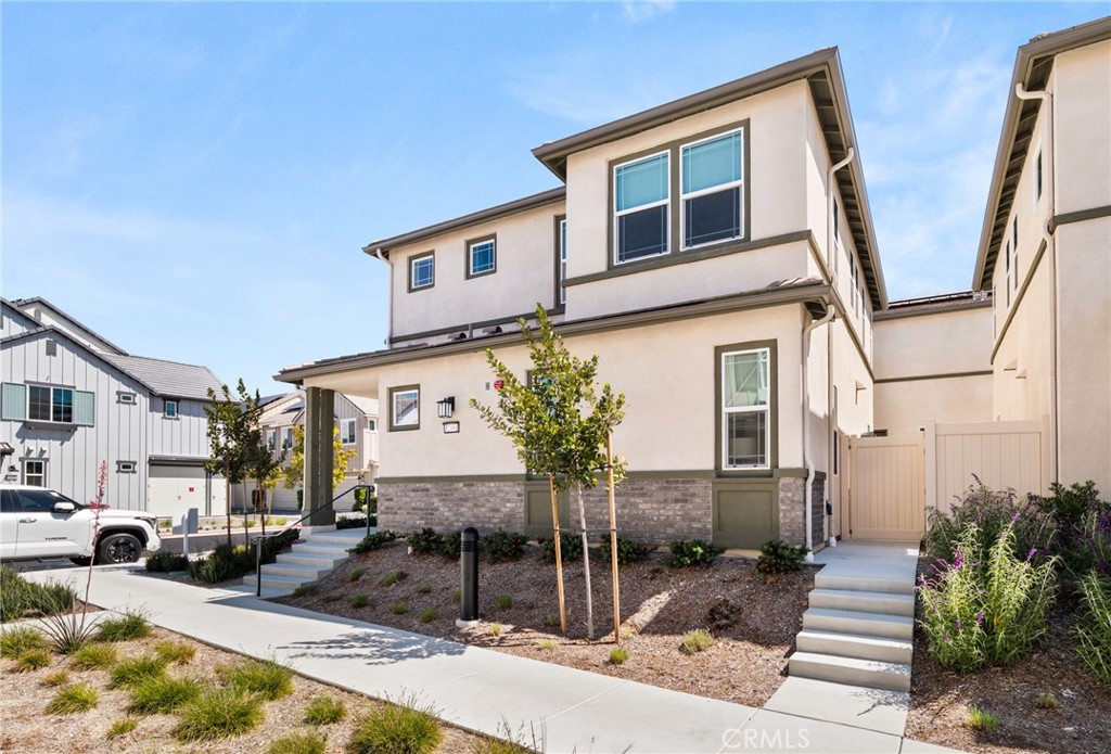 32461 Brunello Way Temecula, CA 92591 - Photo 2 of 46 a front view of a house with garden