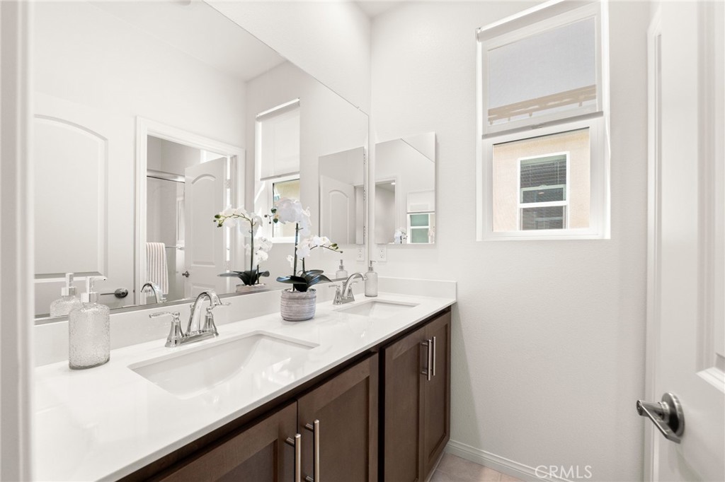 32461 Brunello Way Temecula, CA 92591 - Photo 25 of 46 a bathroom with a sink double vanity and a mirror