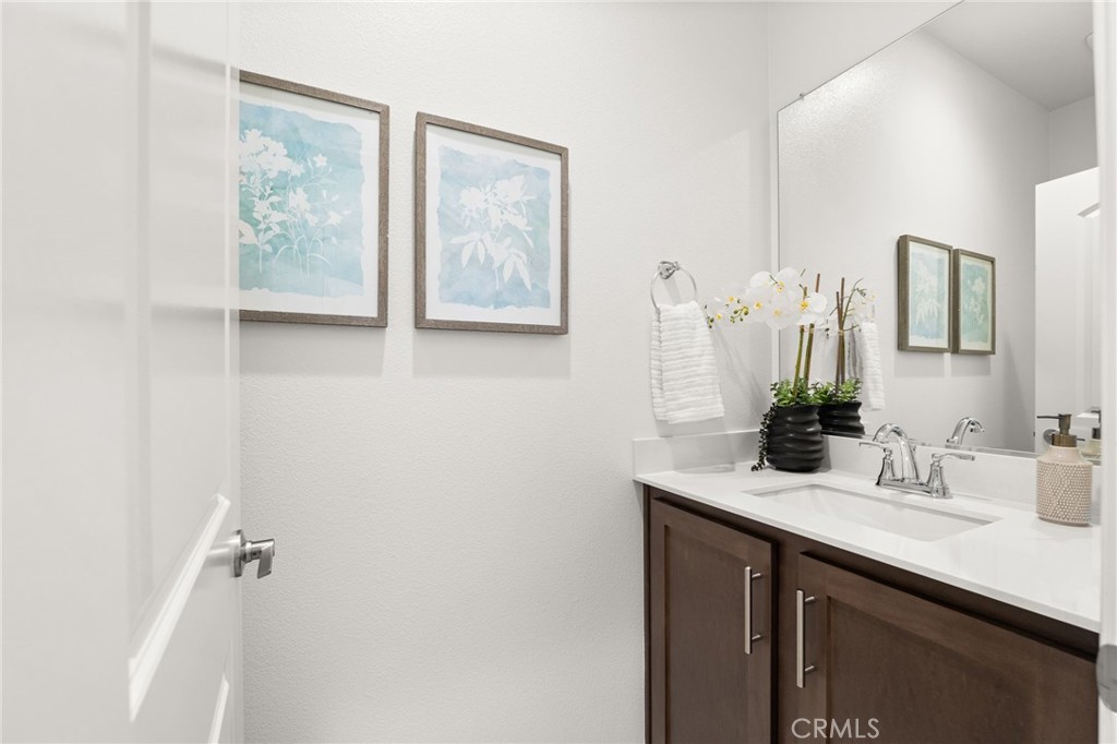 32461 Brunello Way Temecula, CA 92591 - Photo 31 of 46 a bathroom with a sink and a mirror