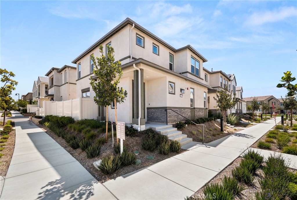32461 Brunello Way Temecula, CA 92591 - Photo 5 of 46 a front view of a house with garden