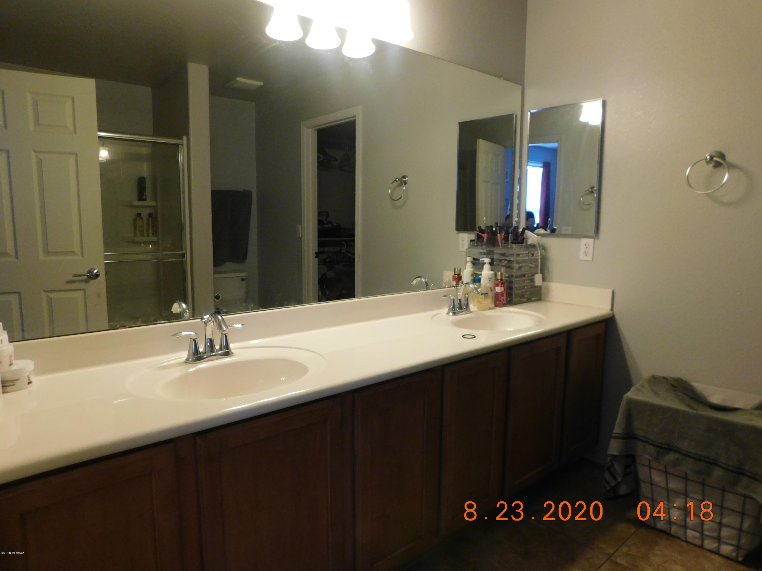 20827 East Reunion Road Red Rock, AZ 85145 - Photo 16 of 19 a bathroom with a sink vanity and a mirror