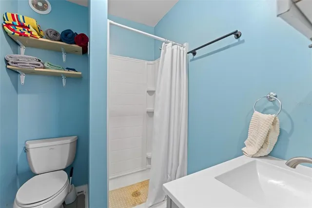 a view of an ocean with city and mountain