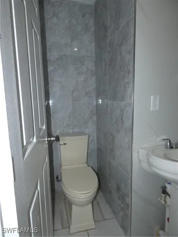 a bathroom with a toilet and a sink