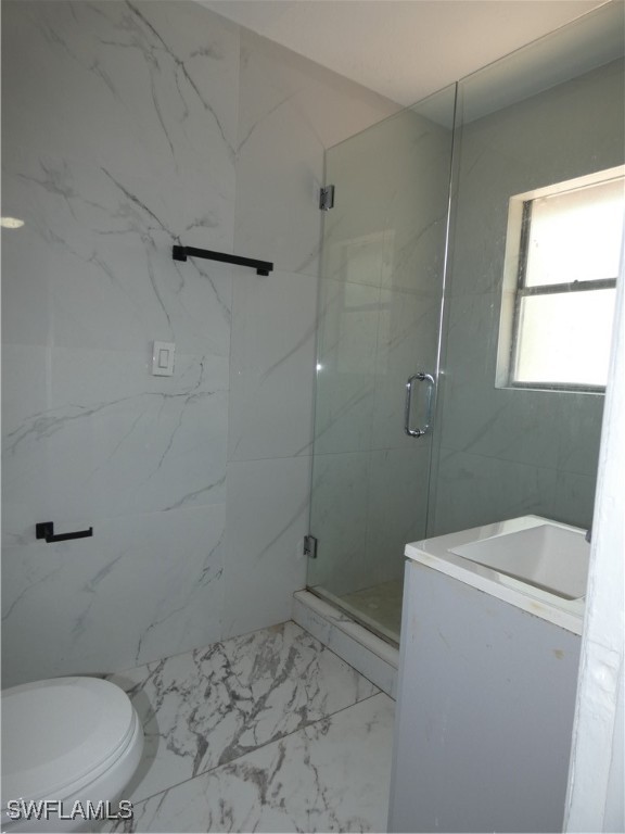 3817 Pearl Street Fort Myers, FL 33916 - Photo 14 of 21 a bathroom with a granite countertop toilet and a sink