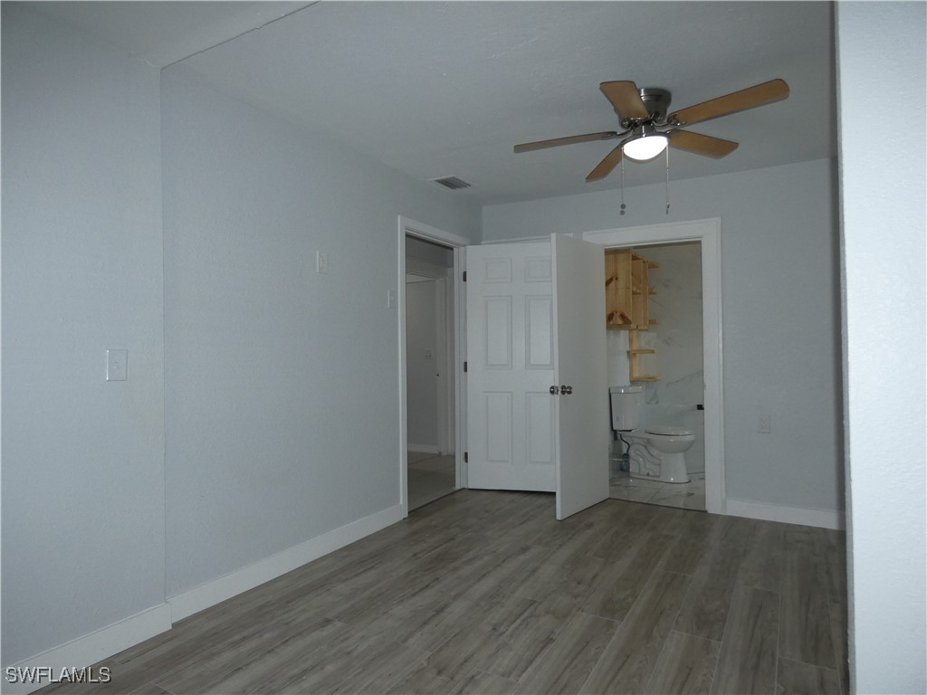 3817 Pearl Street Fort Myers, FL 33916 - Photo 17 of 21 wooden floor in an empty room