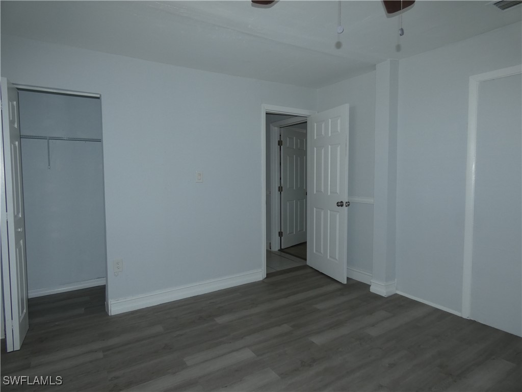 3817 Pearl Street Fort Myers, FL 33916 - Photo 18 of 21 a view of an empty room with wooden floor