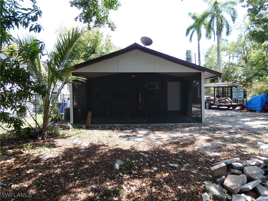 3817 Pearl Street Fort Myers, FL 33916 - Photo 20 of 21 a house with trees in front of it