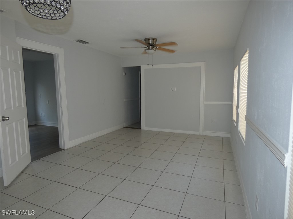 3817 Pearl Street Fort Myers, FL 33916 - Photo 4 of 21 an empty room with a empty space and windows