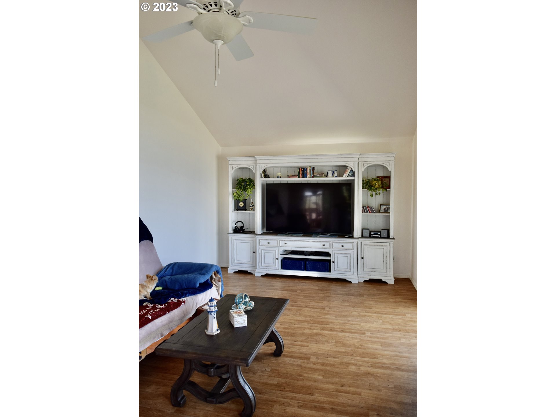 33074 Nesika Road Gold Beach, OR 97444 - Photo 12 of 40 a living room with furniture and a flat screen tv
