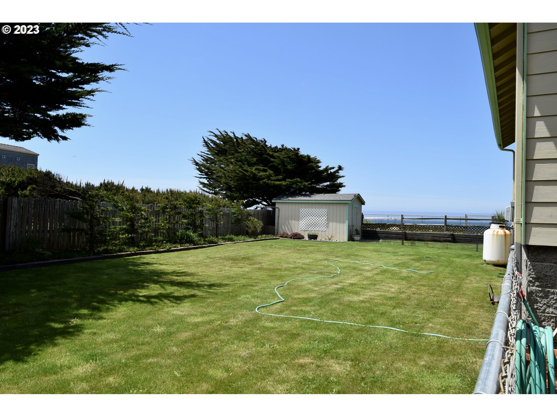 33074 Nesika Road Gold Beach, OR 97444 - Photo 24 of 40 a house with a big yard