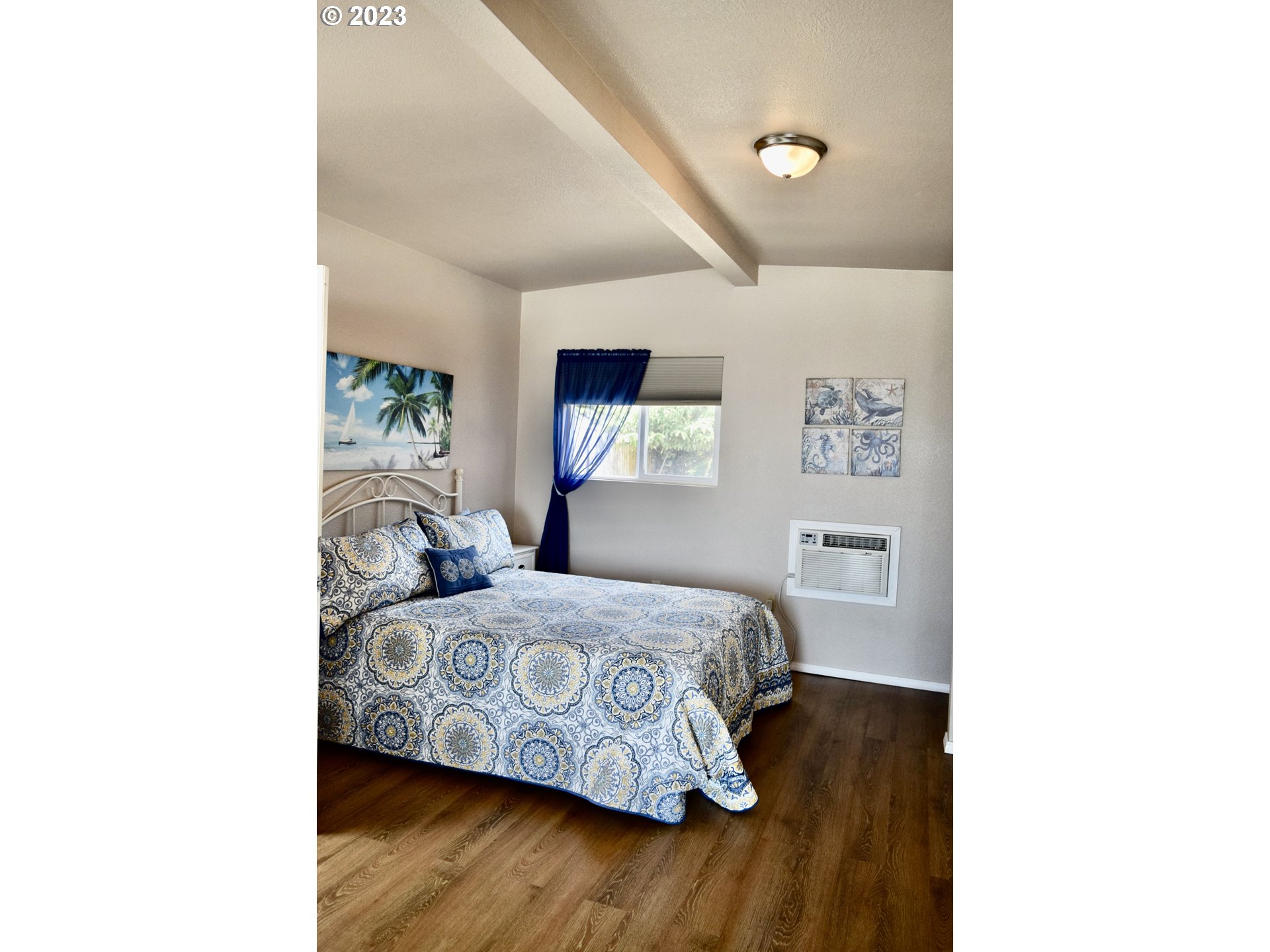 33074 Nesika Road Gold Beach, OR 97444 - Photo 36 of 40 a bedroom with a bed and window