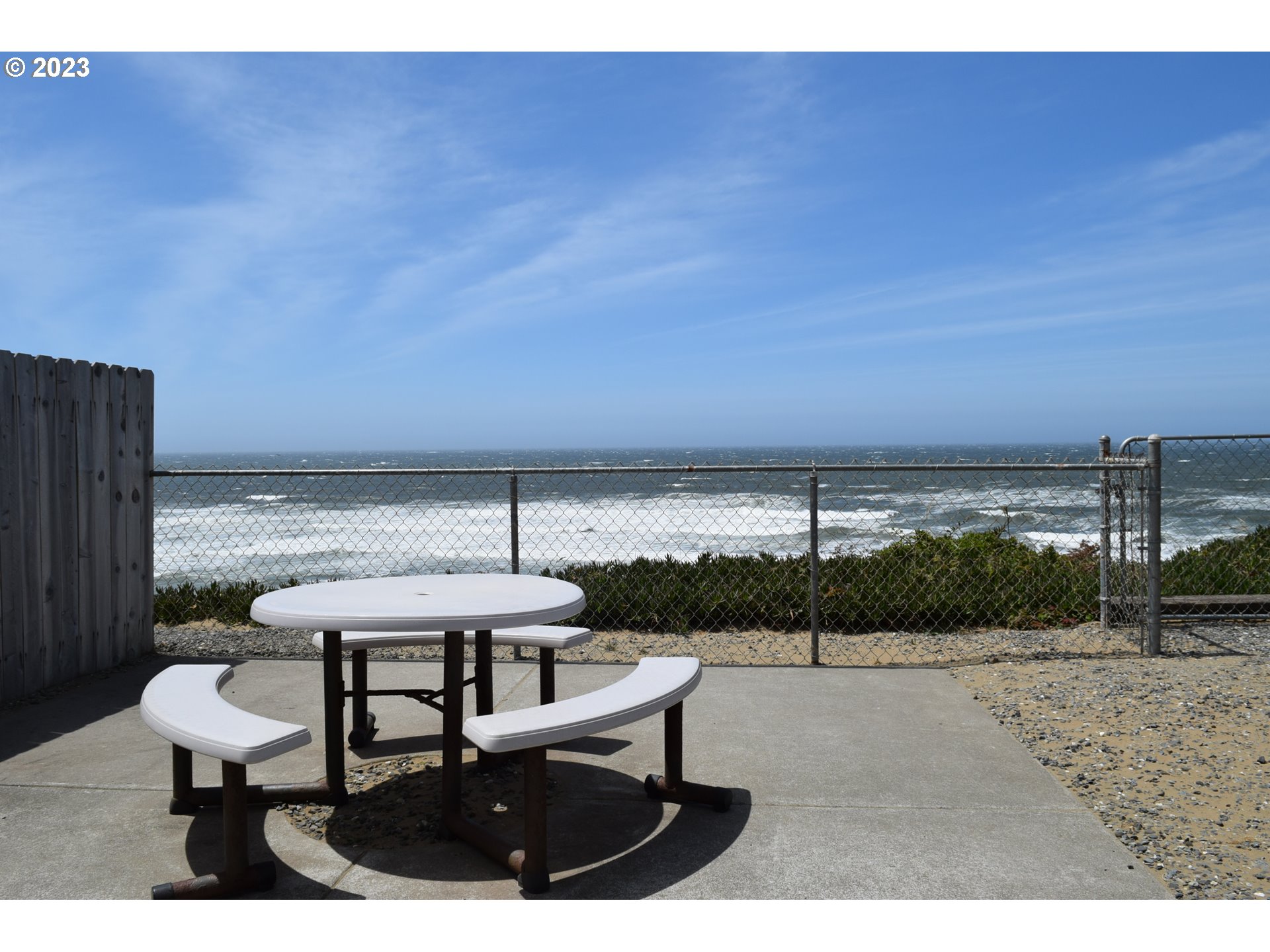 33074 Nesika Road Gold Beach, OR 97444 - Photo 39 of 40 a view of a terrace with a table and chairs