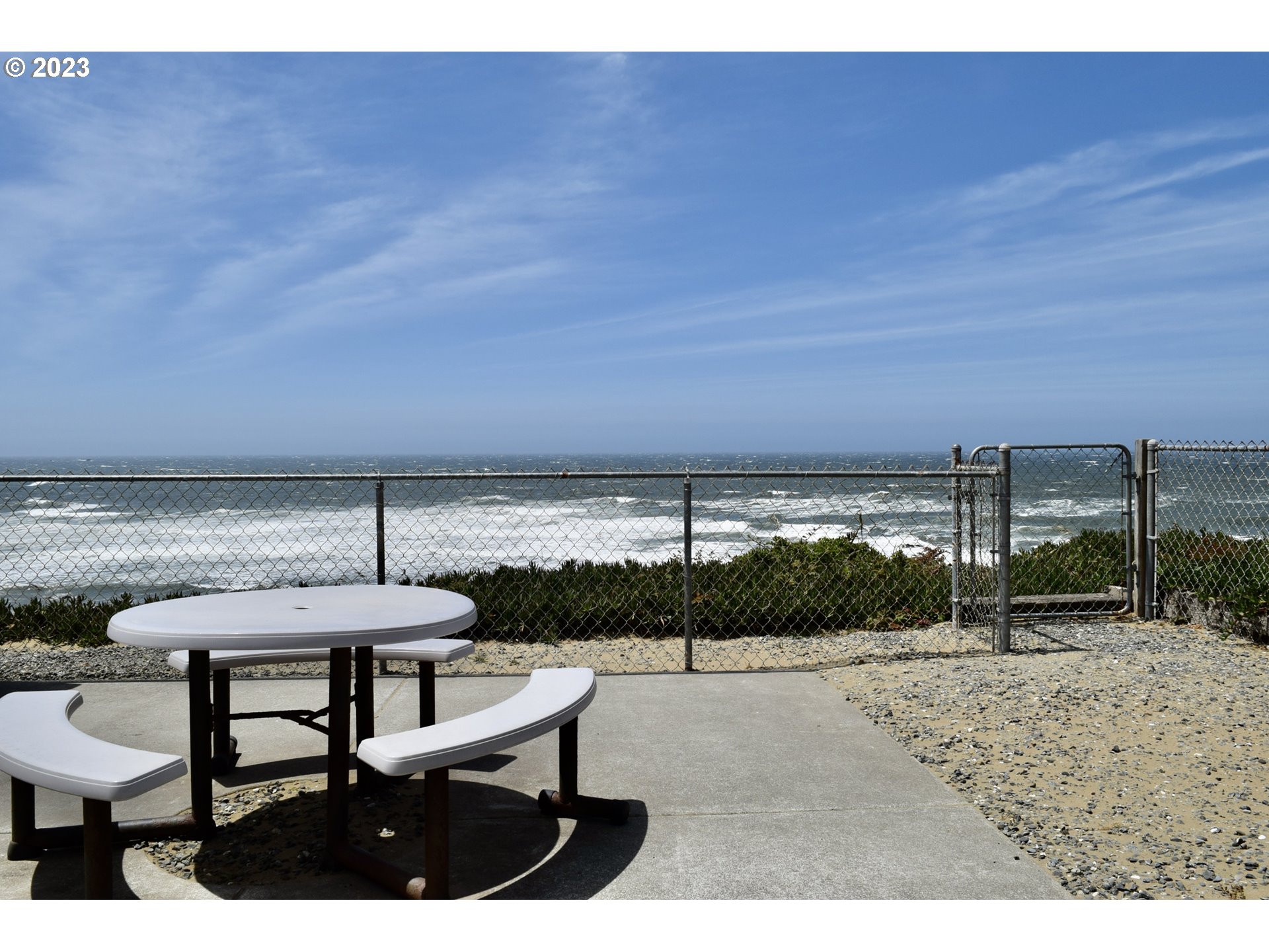 33074 Nesika Road Gold Beach, OR 97444 - Photo 40 of 40 a view of a terrace with a table and chairs