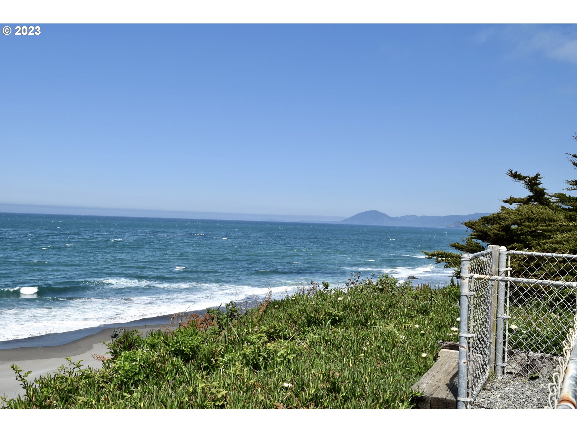 33074 Nesika Road Gold Beach, OR 97444 - Photo 4 of 40 a view of a lake and a yard