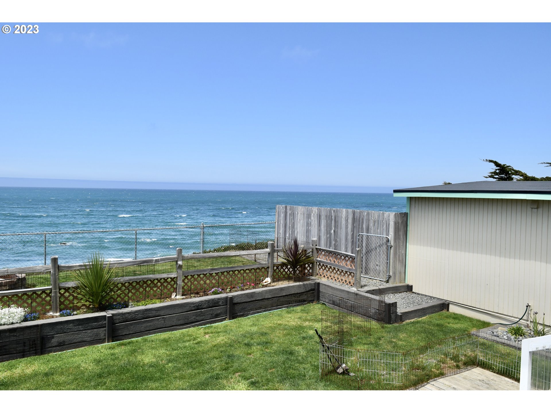 33074 Nesika Road Gold Beach, OR 97444 - Photo 8 of 40 a view of a terrace with a yard