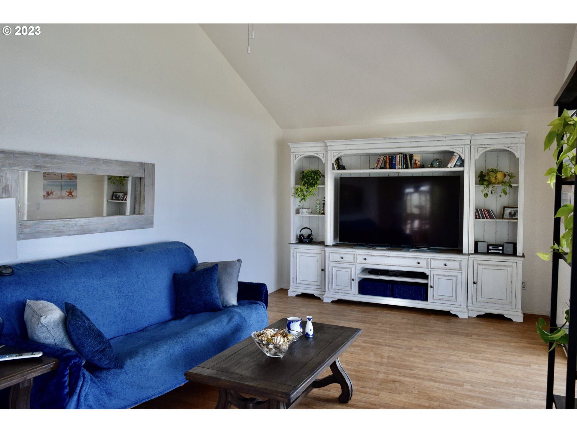 33074 Nesika Road Gold Beach, OR 97444 - Photo 9 of 40 a living room with furniture and a flat screen tv