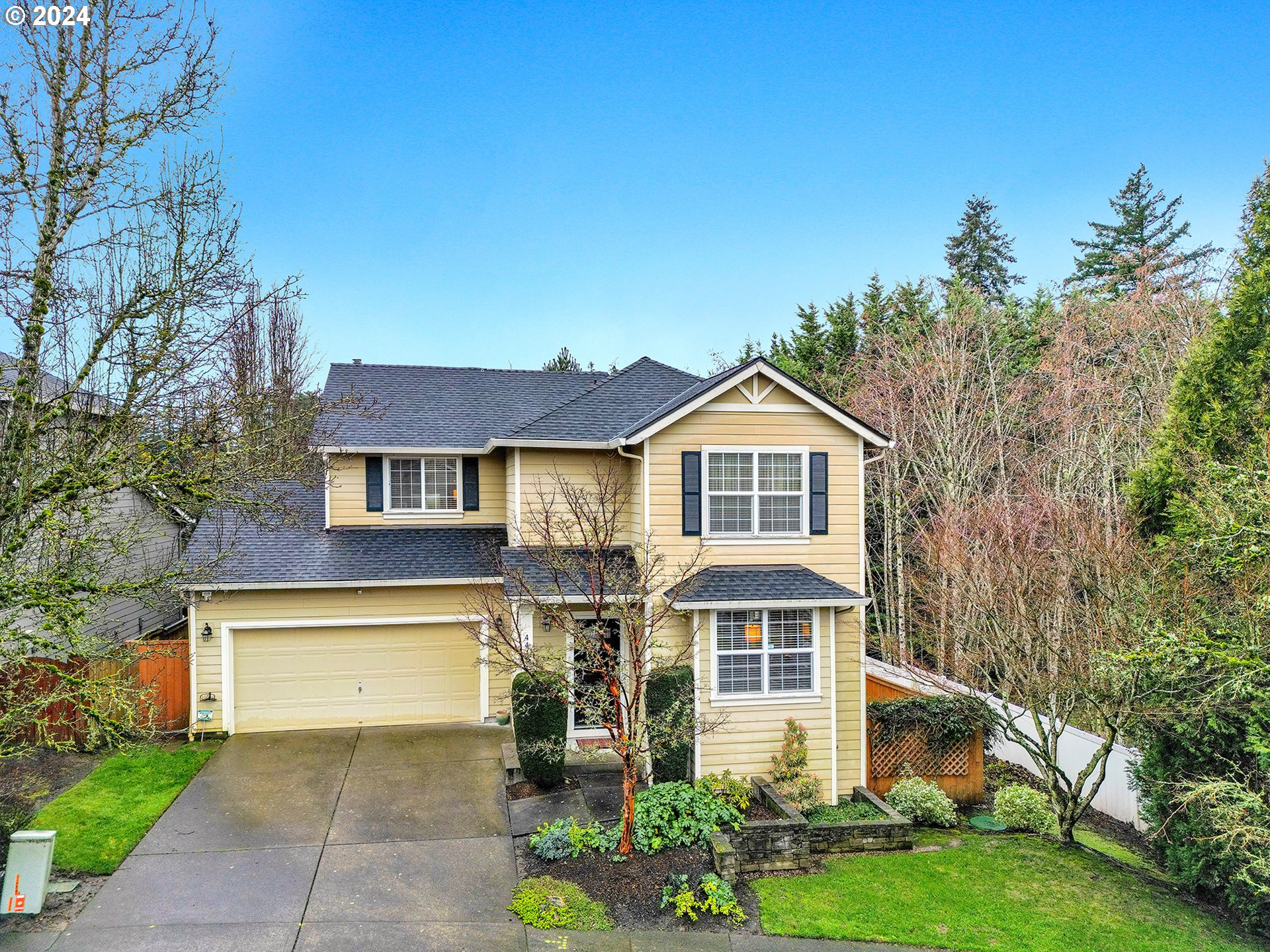 4412 Northwest 12th Avenue Camas, WA 98607 - Photo 1 of 33 a front view of a house with a yard and potted plants