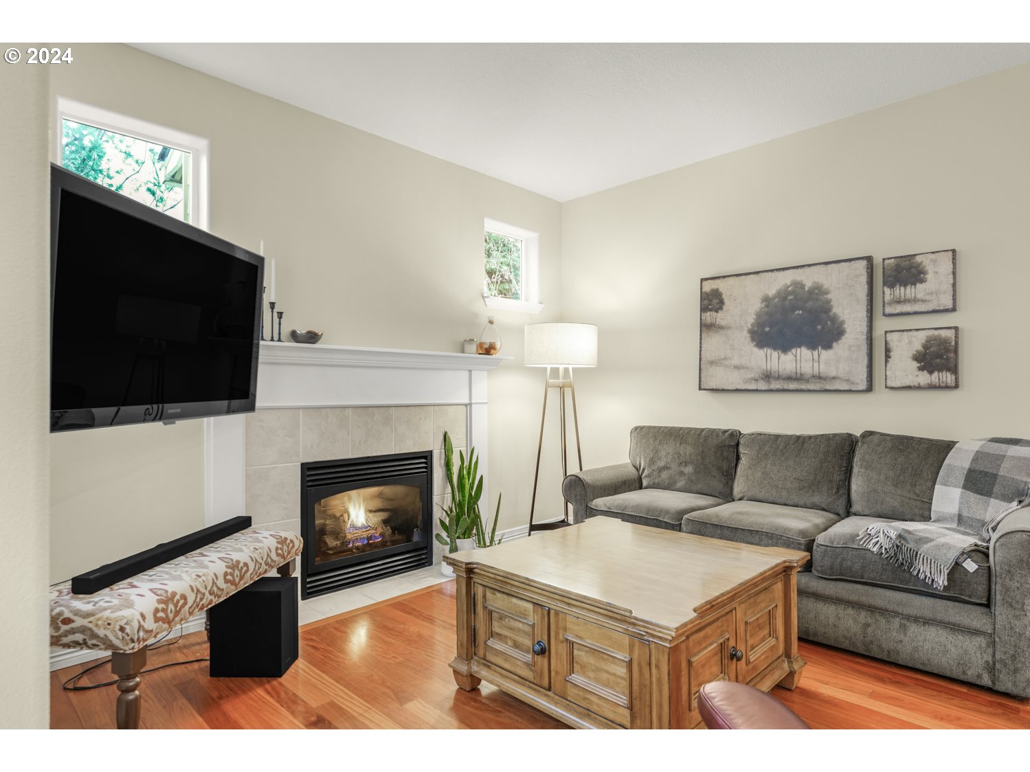 4412 Northwest 12th Avenue Camas, WA 98607 - Photo 11 of 33 a living room with furniture a flat screen tv and a fireplace