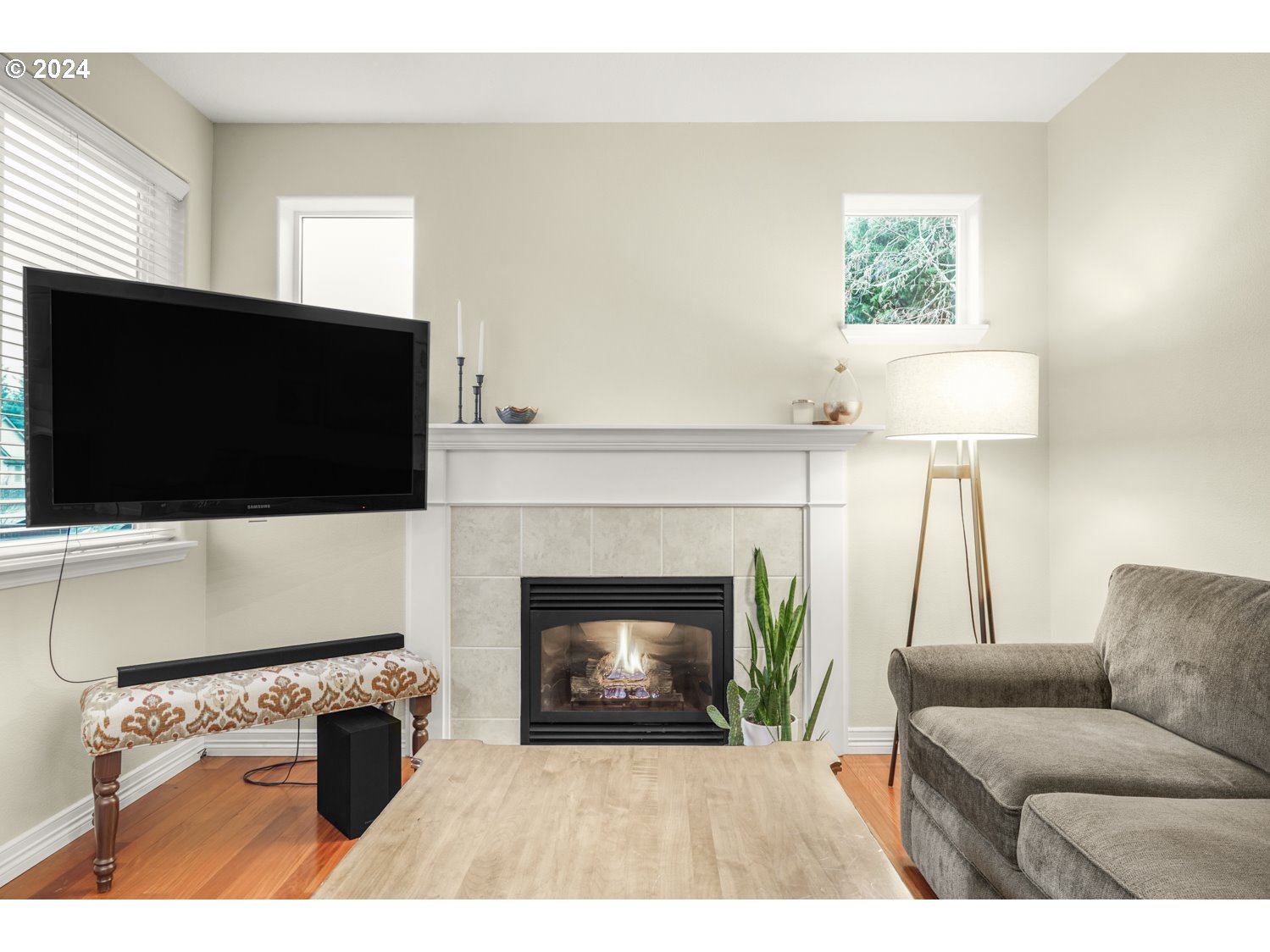 4412 Northwest 12th Avenue Camas, WA 98607 - Photo 12 of 33 a living room with furniture a flat screen tv and a fireplace