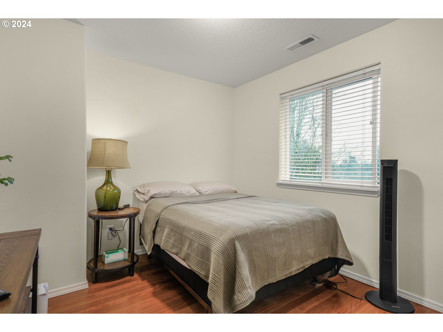 4412 Northwest 12th Avenue Camas, WA 98607 - Photo 18 of 33 a bedroom with a bed a table and chair