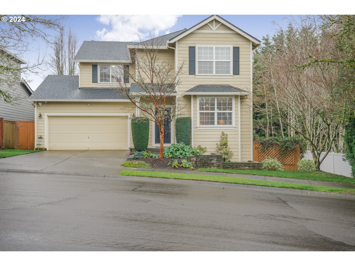 4412 Northwest 12th Avenue Camas, WA 98607 - Photo 29 of 33 a front view of a house with a yard and garage