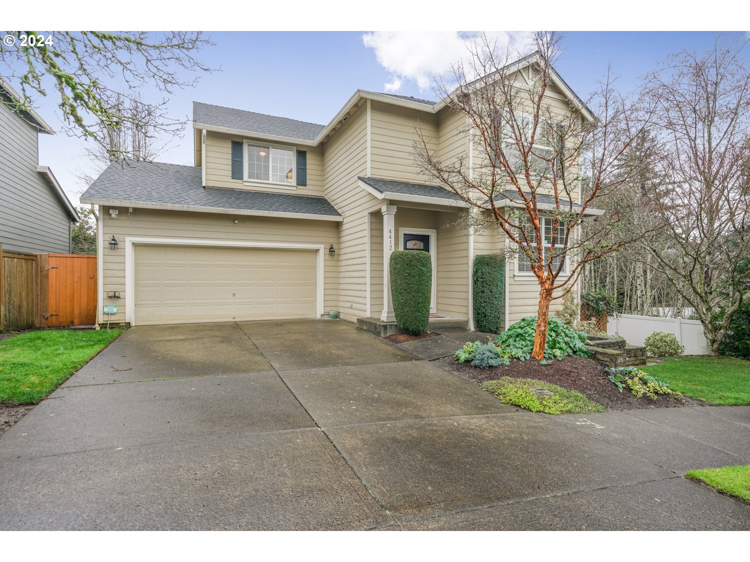 4412 Northwest 12th Avenue Camas, WA 98607 - Photo 30 of 33 a front view of a house with a yard and garage