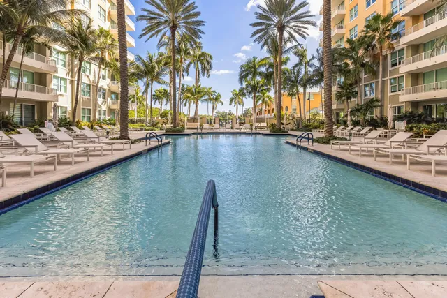a view of swimming pool with outdoor seating